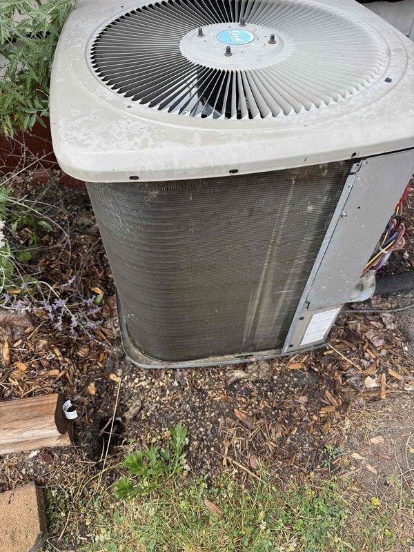 Responded to service call for thermostat not regulating air properly. Upon arrival, verified system was heating and cooling with no loss of function. Performed comprehensive thermostat diagnostic check and system evaluation. Inspected outdoor condenser unit, which showed normal operational wear with accumulated dirt and debris on exterior panels and coil fins. Verified electrical connections at condenser were secure with proper wiring configuration. System operating within normal parameters with no immediate safety concerns identified. Completed work order without complications.