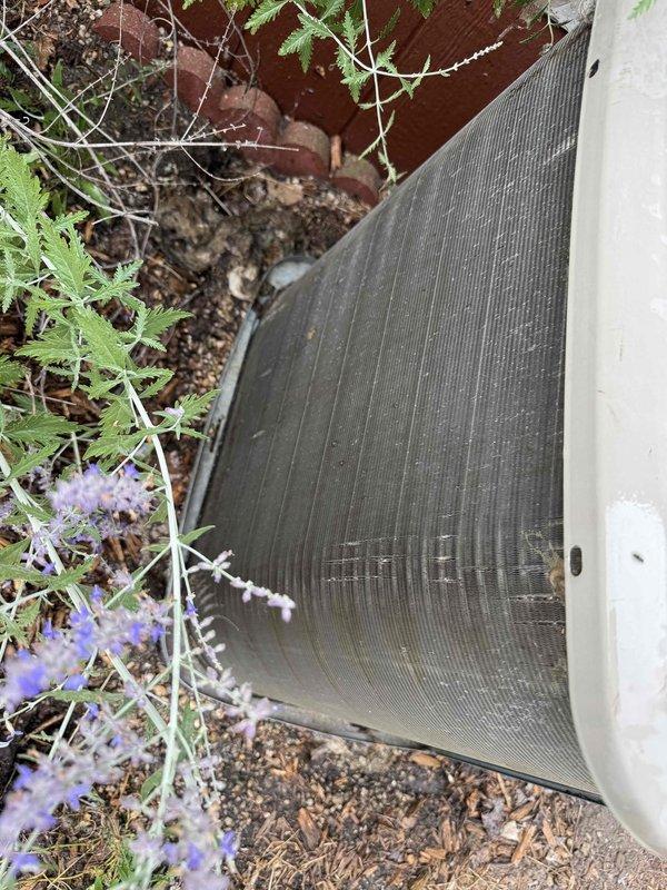 Responded to service call for thermostat not regulating air properly. Upon arrival, verified system was heating and cooling with no loss of function. Performed comprehensive thermostat diagnostic check and system evaluation. Inspected outdoor condenser unit, which showed normal operational wear with accumulated dirt and debris on exterior panels and coil fins. Verified electrical connections at condenser were secure with proper wiring configuration. System operating within normal parameters with no immediate safety concerns identified. Completed work order without complications.