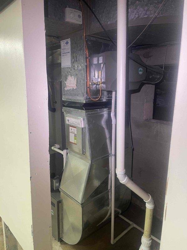 Completed full system estimate for residential HVAC replacement. Assessed existing undersized 3-ton Lennox system with refrigerant leak requiring annual recharge. Documented current equipment installation in utility closet, measured available clearances, and photographed furnace configuration, ductwork connections, and spatial constraints to determine feasibility of upgrading to properly-sized 4-5 ton system.