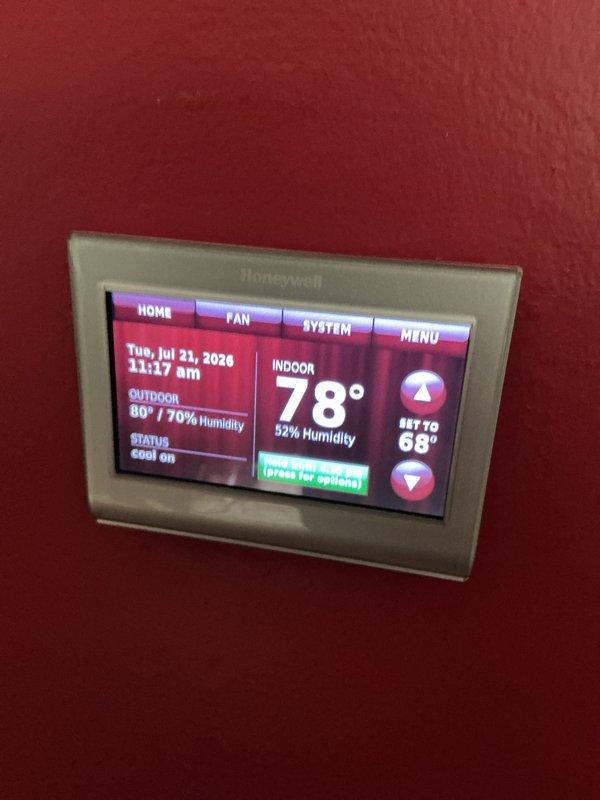 Completed routine air conditioning maintenance on residential HVAC system. Performed comprehensive inspection of condensing unit, verified proper refrigerant pressures and system operation, confirmed thermostat functionality displaying 78°F indoor temperature with cooling mode engaged and set point at 68°F, and documented equipment condition through photographic records.