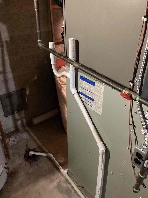 Completed installation of 3-ton air conditioning system with evaporator coil in basement utility area. Connected refrigerant lines to existing furnace, installed copper piping with proper insulation, and integrated all ductwork connections. Verified all electrical connections, tested system operation, and ensured proper airflow through newly installed components.