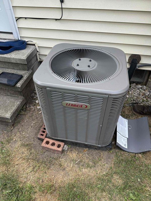 Responded to service call for Lennox air conditioning unit with non-operational condenser fan while compressor was running. Performed diagnostic inspection on 5-year-old basement-located system and identified failed fan motor. Replaced defective condenser fan motor and verified proper operation of unit with adequate airflow through coil. System restored to full cooling capacity with parts covered under warranty.