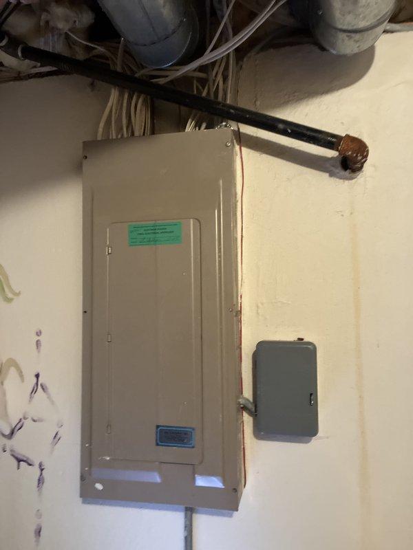 Conducted comprehensive assessment of existing HVAC system for complete replacement estimate. Inspected 20-year-old furnace unit, documenting internal components including blower motor assembly, control board, and electrical connections. Evaluated condition of air conditioning system of similar age. Both units have reached end of expected service life and require replacement to maintain reliable whole-house climate control. Photographed furnace interior showing typical age-related wear on components and electrical panel installation with associated ductwork and utilities. Provided detailed replacement recommendations for complete system upgrade.