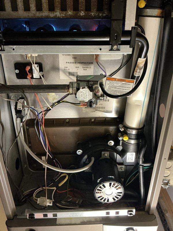 Completed comprehensive tune-up maintenance on both heating and cooling systems. Performed full system inspection, confirmed proper operation of gas furnace with burner assembly showing active combustion and appropriate flame characteristics. Replaced furnace air filter as requested. Verified all mechanical and electrical components functioning correctly, including blower motor, gas valve assembly, and control systems. Both HVAC units operating within normal parameters with no issues identified.
