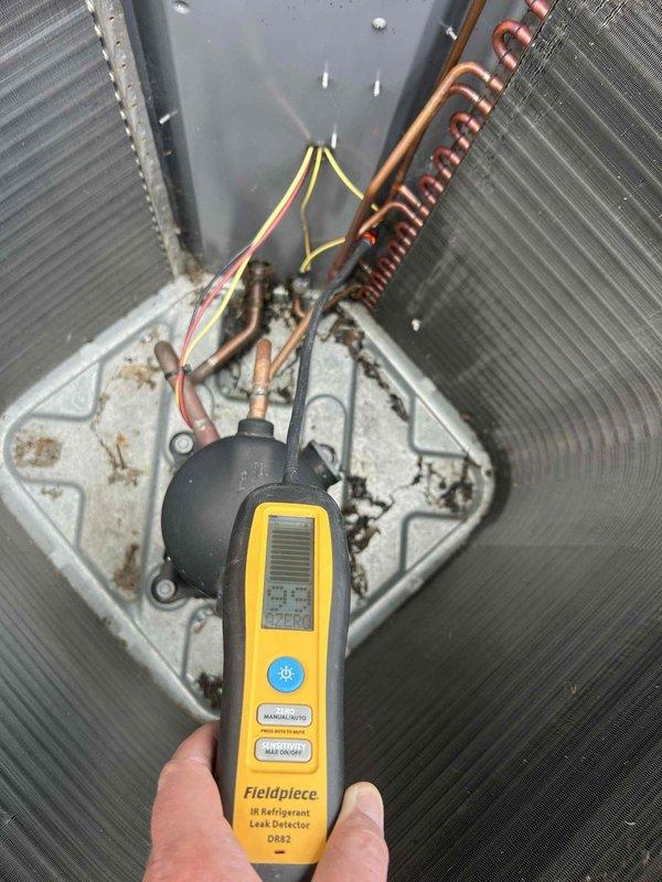 Responded to no cooling complaint with reported oil substance leak underneath outdoor unit. Upon arrival, performed comprehensive system inspection and utilized infrared refrigerant leak detector to diagnose issue. Identified refrigerant leak in system requiring repair, supplied necessary parts for resolution while customer declined labor coverage.
