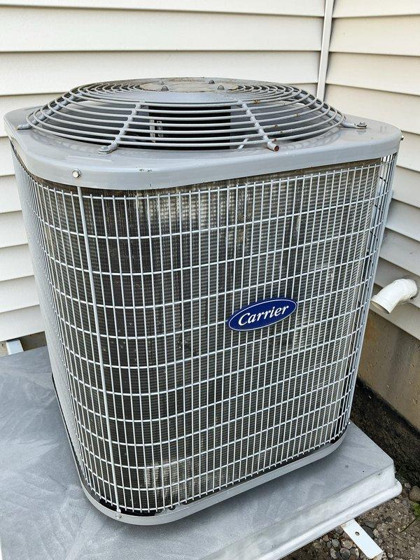 Completed annual cooling maintenance on Carrier HVAC system. Inspected indoor furnace unit and outdoor condenser, changed air filter, cleaned condenser coil and pad, verified proper system operation and airflow throughout equipment.