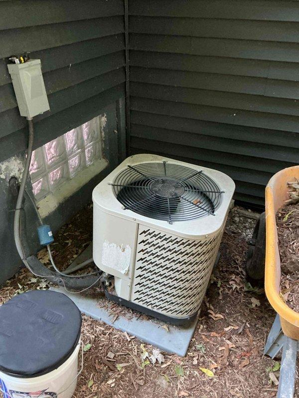Responded to no-cool complaint with frozen evaporator coil on indoor furnace unit. Upon arrival, system had been shut down by customer and ice had melted. Inspected both indoor air handler in basement and outdoor condensing unit. Found system operational but not cooling adequately to setpoint. Identified restricted airflow as likely cause of coil freeze-up. Verified refrigerant lines, checked system operation, and documented equipment condition with photos. Recommended filter replacement and further diagnostics to determine underlying cause of inadequate cooling performance and prevent future coil icing.