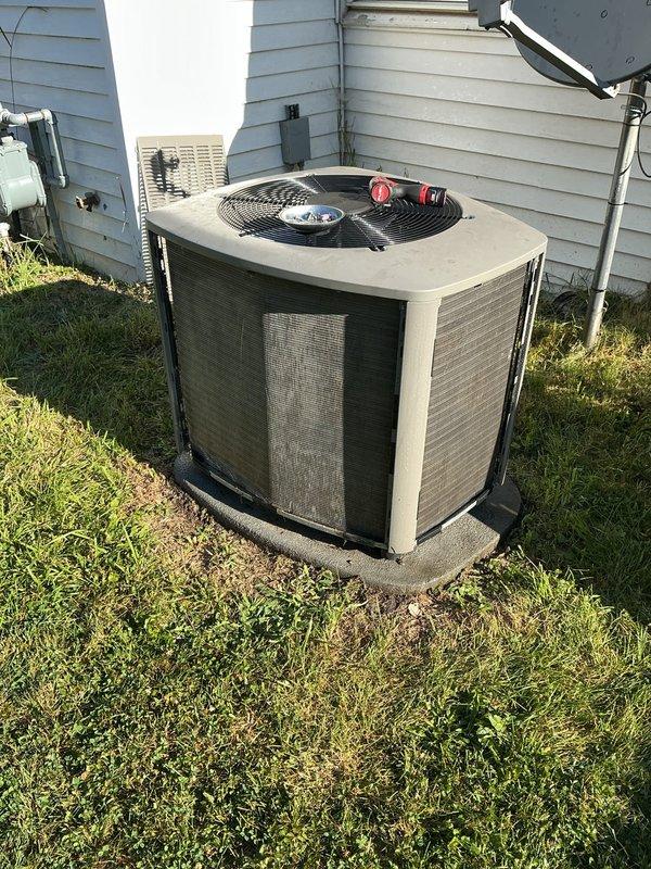 Completed annual HVAC maintenance on residential outdoor condensing unit. Performed comprehensive system inspection, verified refrigerant levels at service ports, checked electrical connections, and assessed overall equipment condition. Unit showing normal wear consistent with outdoor exposure but operating within acceptable parameters. Documentation photos captured for service records.
