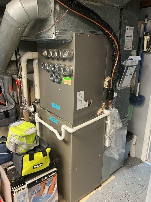 Completed annual maintenance on residential HVAC system, including inspection of evaporator coil, heat exchanger assembly, and refrigerant lines. Replaced air filter, verified proper operation of all components, and documented system condition with photos showing serpentine coil configuration and overall unit functionality in good working order.