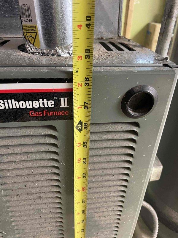 Conducted full system replacement estimate for residential property with 20-year-old air conditioning unit and Silhouette II gas furnace located in basement. Performed measurements and photographic documentation of existing equipment to determine proper sizing and clearance requirements for new HVAC system installation, with planned completion by end of August.