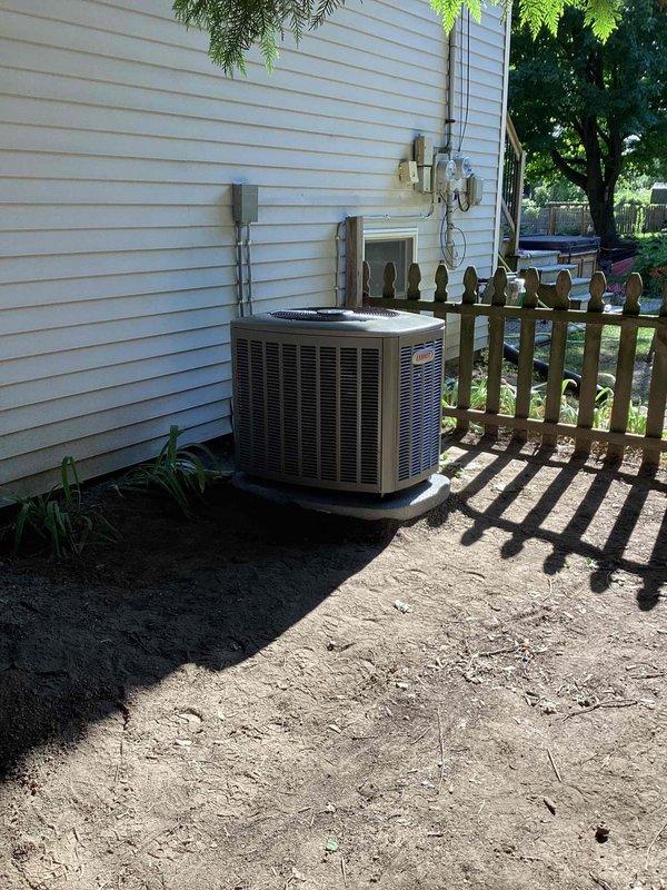 Completed full HVAC system installation including Lennox 70,000 BTU gas furnace, 2.5-ton air conditioning unit with matching evaporator coil, and humidifier. Installed outdoor condensing unit (model CK40CT-30B-71) on concrete pad against exterior wall with proper clearances, completed all refrigerant line connections, and reconnected electrical service. System tested and verified operational with all safety labels and manufacturer documentation in place.