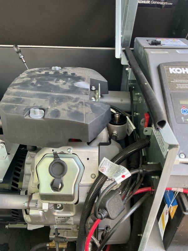 Completed comprehensive ComfortGuard 5-year maintenance visit on residential HVAC system and 20KW Kohler generator. Performed routine inspection and maintenance procedures on generator components including engine assembly, fuel system, electrical connections, and housing panels, verifying proper operation of all mechanical systems. Inspected outdoor air conditioning condenser unit and accompanying HVAC equipment, noting exterior weathering and vegetation encroachment around equipment pad requiring future attention for optimal airflow and system performance.