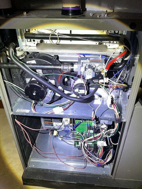 Completed comprehensive 5-year ComfortGuard maintenance inspection on residential gas furnace system. Performed thorough examination of all internal components including blower motor assembly, heat exchanger, gas valve, control board, and electrical connections. Verified proper operation of all safety controls, inspected wiring harnesses for wear or damage, and confirmed LED diagnostic indicators functioning correctly. All components found operating within normal parameters with no issues identified requiring immediate attention.