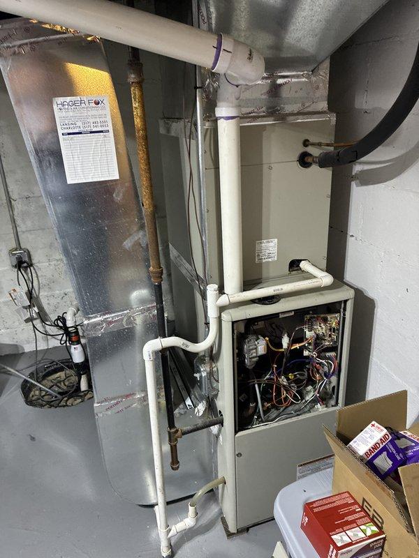 Conducted comprehensive assessment of non-operational HVAC system located in basement mechanical room. Evaluated existing heating and cooling equipment with age unknown per homeowner, inspected internal components including wiring, circuit boards, and mechanical assemblies. Documented current system configuration including PVC condensate drainage, copper refrigerant lines, and ductwork connections. Provided detailed replacement estimate for new air conditioning and furnace system to restore climate control functionality to residence.