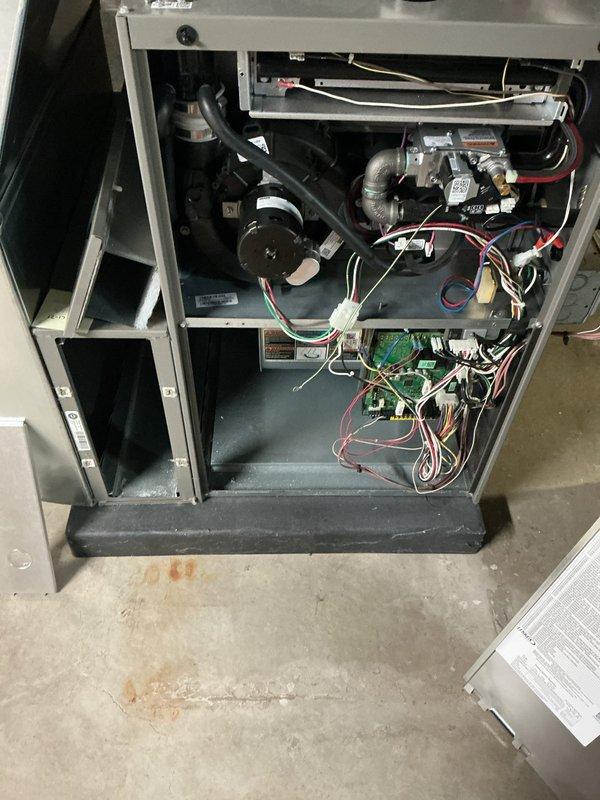 Completed comprehensive ComfortGuard Maintenance service on residential HVAC system. Performed full system inspection and replaced dirty pleated air filter with new unit and installed fresh humidifier pad as part of scheduled 5-year recurring maintenance program. Accessed furnace interior compartment to inspect blower motor assembly, electrical connections, control board, and all mechanical components. Verified proper operation of all system controls, wiring connections, and safety mechanisms. System operating within normal parameters upon completion of maintenance procedures.