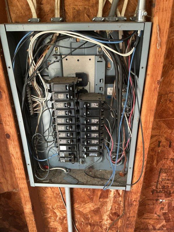 Completed comprehensive whole home electrical inspection in response to customer concerns about occasional smoky smell near rear of property and to verify electrical system safety following recent siding installation work. Thoroughly examined main electrical service panel, which is mounted on exposed studs in unfinished utility area, noting mixed-age wiring installation with varying levels of organization and visible debris accumulation in panel enclosure. Inspected all circuit breakers, neutral/ground bus bars, and wire connections for proper installation, signs of overheating, arcing, or other safety concerns. Evaluated wire routing, conduit connections, and overall panel condition. Also inspected accessible plumbing and mechanical systems in utility areas during walkthrough. Found no immediate electrical hazards or evidence that smoky smell originates from electrical system; advised customer that odor is likely from external source as suspected. Provided on-site estimate for panel c