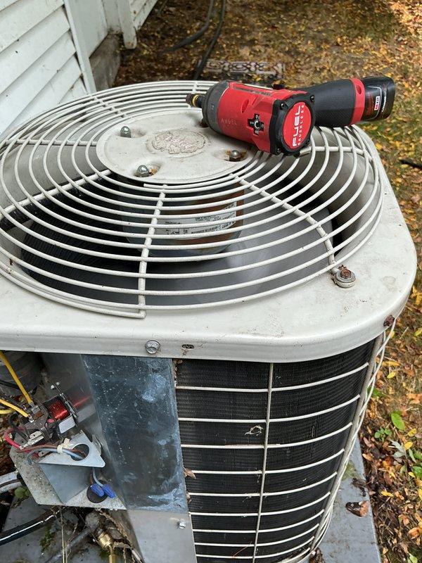 Completed routine air conditioner maintenance under spray maintenance program on a fifteen-year-old system that was operating properly at time of service. Performed comprehensive AC tune-up including inspection of outdoor condenser unit, electrical components, capacitor, and wiring connections. All components found to be in functional condition with typical outdoor weathering present on housing and panels.