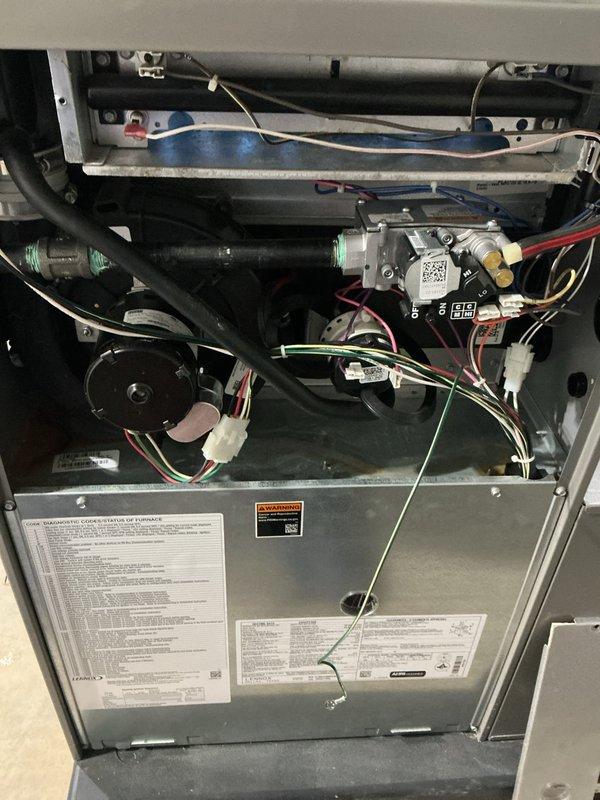 Completed comprehensive 5-year recurring ComfortGuard maintenance inspection on residential HVAC furnace system. Performed full system evaluation with access panel removed to inspect internal components including blower motor assembly, gas valve operation, refrigerant line connections with protective caps, electrical wiring harness, and mounting hardware. Replaced standard air filter with clean pleated media filter rated for proper airflow and filtration efficiency. All mechanical and electrical components found in proper working condition with no deficiencies noted during inspection.
