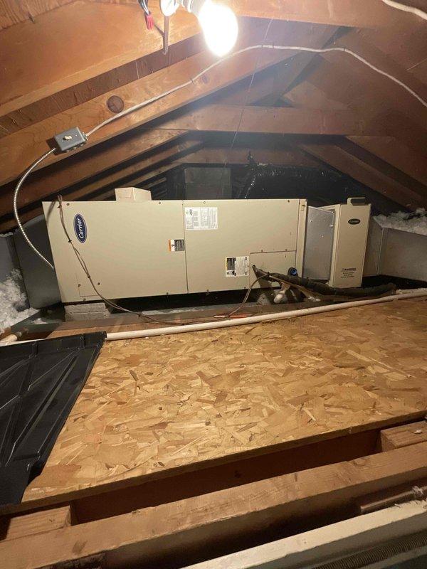 Provided comprehensive estimate for complete air conditioning system replacement in attic location. Current 22-year-old Carrier air handler unit is non-operational and has exceeded its expected service life. Assessed attic-mounted equipment configuration, existing ductwork connections, electrical supply requirements, and platform mounting system to determine appropriate replacement specifications for new high-efficiency cooling system compatible with natural gas furnace operation.