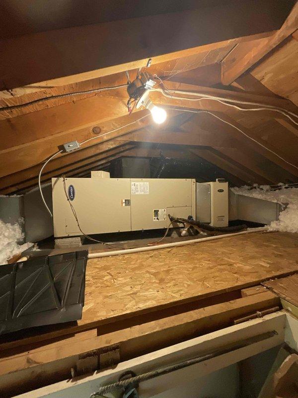 Provided comprehensive estimate for complete air conditioning system replacement in attic location. Current 22-year-old Carrier air handler unit is non-operational and has exceeded its expected service life. Assessed attic-mounted equipment configuration, existing ductwork connections, electrical supply requirements, and platform mounting system to determine appropriate replacement specifications for new high-efficiency cooling system compatible with natural gas furnace operation.