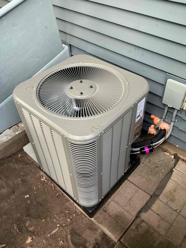 Completed full HVAC system installation including a 70,000 BTU furnace with evaporator coil and a 2-ton air conditioning condenser unit positioned on rear concrete pad. Installed new condensing unit on exterior pad with proper refrigerant line connections, electrical disconnect box, and all necessary fittings and valves. Furnace and coil installed in utility area with proper venting through existing ductwork. All refrigerant lines properly insulated and secured to building exterior. System tested for proper operation, airflow, and refrigerant charge. Electrical connections verified and secured at disconnect box. All mechanical permits obtained prior to installation.