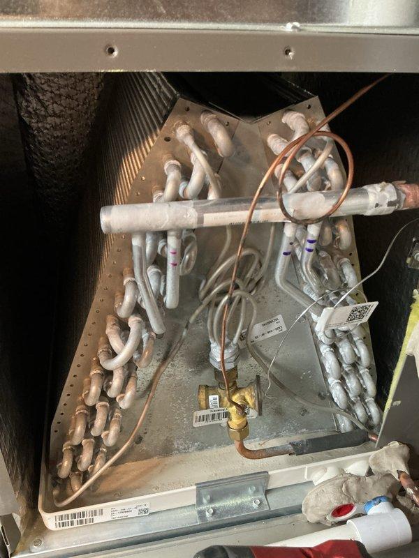 Completed annual cooling maintenance on residential HVAC system. Performed comprehensive inspection of air handler unit, verified proper operation of refrigerant lines and connections, checked thermostat functionality showing system cooling to setpoint of 60°F with current temperature reading of 75°F. Replaced air filter and evaporator pad as scheduled maintenance items.