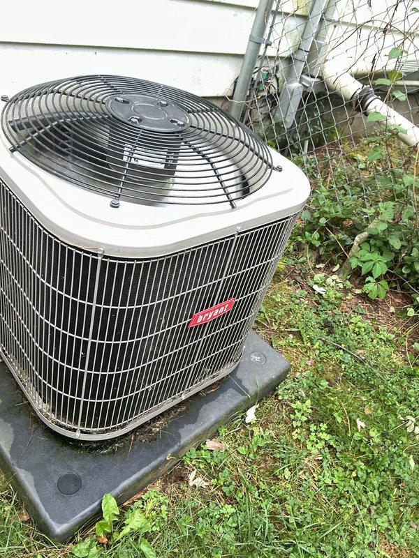 Performed annual cooling tune-up on residential split system air conditioning unit. Inspected indoor evaporator coil assembly located in attic space and outdoor condensing unit with cylindrical fan housing. Completed comprehensive system evaluation including coil condition assessment, refrigerant level verification, electrical connections inspection, and airflow testing. Both indoor and outdoor components showed normal operating condition with minor dust accumulation noted on coil surfaces. Recommended vegetation clearance around outdoor unit to maintain proper airflow and equipment efficiency.