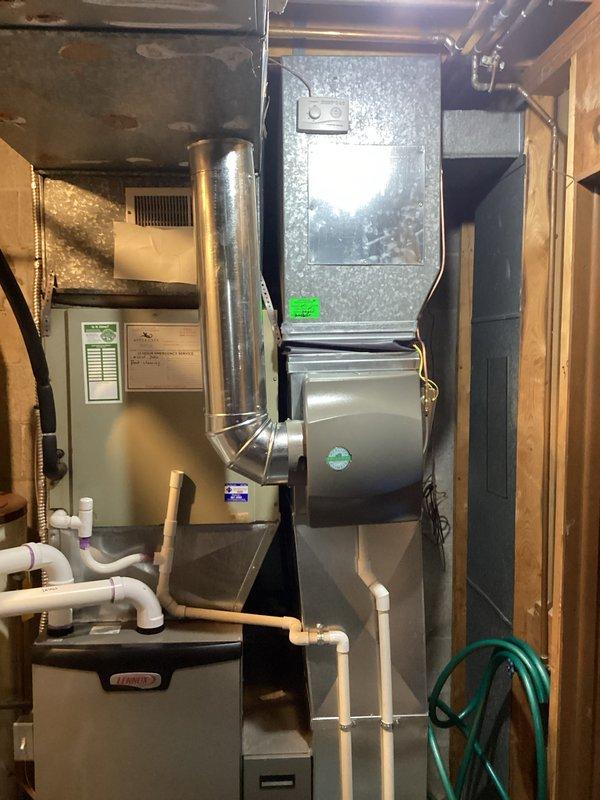 Successfully installed a 17-gallon whole-home humidifier unit in the basement mechanical room, integrating it with the existing HVAC system. Connected the humidifier to the main furnace ductwork using appropriate flex duct routing, and established water supply lines using white PVC plumbing to ensure proper humidity delivery throughout the home. Completed all electrical connections, verified operational functionality, and ensured proper drainage configuration to the existing floor drain system.