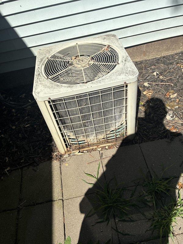 Provided estimate for complete HVAC system replacement including furnace and air conditioning unit for property with non-operational equipment located in crawl space. Inspected existing outdoor condenser unit showing significant weathering, dirt accumulation, and aged condition, along with electrical disconnect and associated infrastructure. Assessed requirements for new natural gas furnace installation and matching condensing unit to replace failed system for prospective property purchaser.