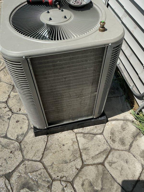 Completed comprehensive 5-year ComfortGuard maintenance service on residential outdoor air conditioning condenser unit. Performed thorough inspection of all system components including condenser coils, fan assembly, electrical connections, refrigerant lines, and disconnect box. Unit exterior showed normal weathering consistent with age, with condenser positioned on proper mounting pad with adequate clearance for airflow and serviceability. All safety controls and electrical connections were verified operational, and system components were found to be functioning within normal parameters for scheduled preventive maintenance protocol.