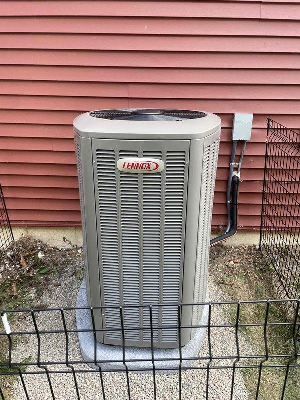 Completed full HVAC system installation including a 90,000 BTU high-efficiency furnace with integrated humidifier, 3-ton air conditioning unit positioned on left side of property, and tankless water heater. All mechanical equipment installed in basement utility area with proper ductwork connections, refrigerant lines run to exterior condensing unit mounted on concrete pad, and necessary electrical disconnects installed per code requirements.