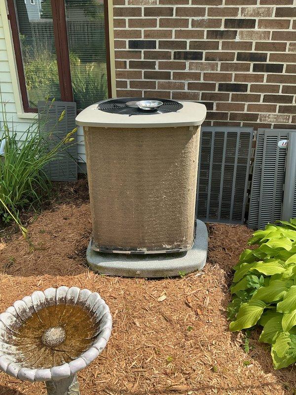 Performed air conditioning startup and inspection on Lennox condensing unit (Model SX35365-6F-20). Unit was successfully energized and operational following winter shutdown. Exterior cabinet showed significant dust and debris accumulation but unit functioned properly upon startup. Verified refrigerant specifications and safety labels present on equipment.