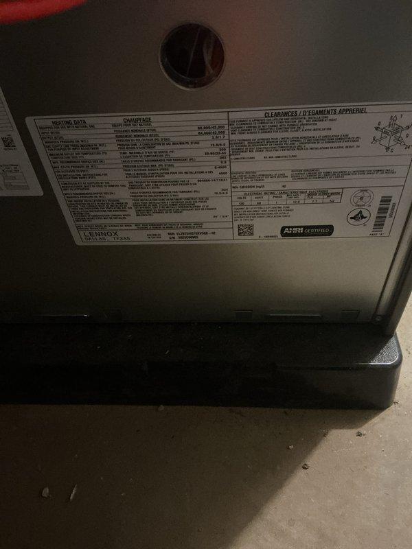 Completed annual preventative maintenance on one-year-old Lennox forced air furnace and air conditioning system. Performed comprehensive inspection of gas valve assembly, electrical connections, and internal components with all systems found operating within normal parameters. Documented equipment condition through photography showing proper installation, secure wiring connections (red, yellow, and white leads), and intact manufacturer specifications label with AHRI certification, with no deficiencies noted and both units confirmed in proper working order.