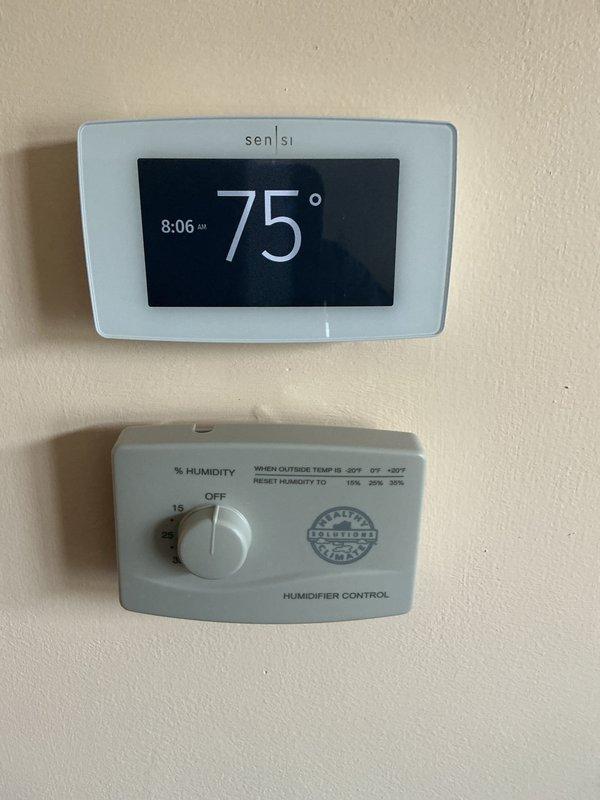 Completed scheduled air conditioning maintenance service responding to urgency list request with adjusted morning time window. Replaced 16x25x5 pleated media air filter and verified proper operation of digital Sensi thermostat displaying 75°F and humidifier control unit with seasonal adjustment settings.