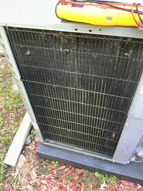 Completed scheduled air conditioning maintenance on International Comfort Products indoor unit model EN04X48L24A1 and corresponding outdoor condensing unit. Performed comprehensive system inspection, documented equipment condition with photos showing manufacturer data plate and R-410A refrigerant specifications, inspected outdoor coil assembly noting debris accumulation between fins, and verified compressor connections and refrigerant lines were secure with no visible leaks.