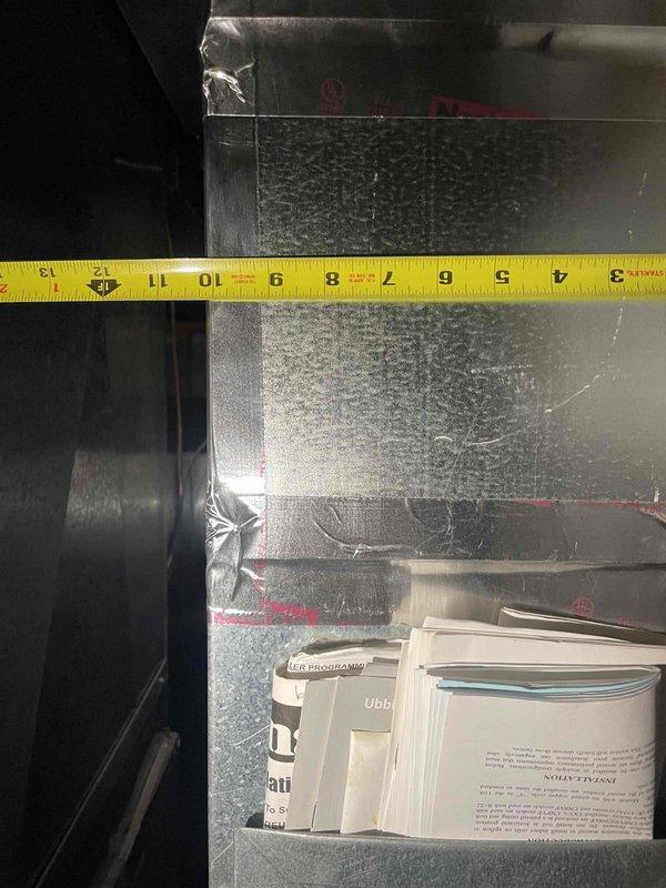 Completed comprehensive assessment of 12-year-old forced air HVAC system with natural gas furnace and air conditioning unit located in basement. Performed detailed measurements of existing ductwork and plenum dimensions to evaluate system specifications and determine replacement requirements for full system installation. Documented current equipment configuration and structural measurements necessary for proper sizing and installation planning of new heating and cooling equipment.