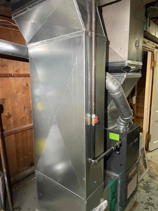 Performed comprehensive evaluation of existing furnace system and ductwork infrastructure to assess feasibility of adding central air conditioning to recently purchased home. Inspected furnace unit installed within last few years for potential water damage from previous basement flooding incident, verifying operational integrity and examining all components for moisture intrusion or corrosion. Evaluated existing plenum, supply ductwork, and trunk line configuration in basement and attic spaces to confirm AC-ready installation capability. Assessed electrical service capacity, refrigerant line routing pathways, condensate drain options, and outdoor condenser placement locations. Documented current HVAC system layout including flexible and rigid ductwork connections, air handler positioning, and structural framing considerations. Provided detailed estimate for complete air conditioning system addition including evaporator coil integration with existing furnace, outdoor condensing unit, re