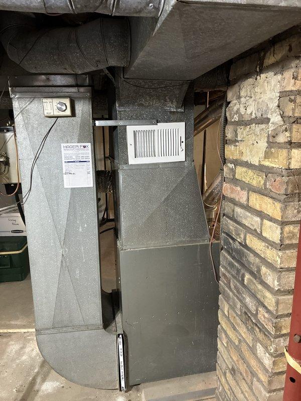 Conducted full system evaluation for HVAC replacement quote following previous maintenance visit that identified R22 refrigerant system operating below optimal charge levels. Assessed existing Ruud furnace and air conditioning system in basement mechanical room, documenting current equipment configuration including ductwork connections and clearances. Additionally evaluated existing water heater for replacement quote as requested, inspecting plumbing connections and venting requirements to provide comprehensive pricing for complete mechanical system upgrade.