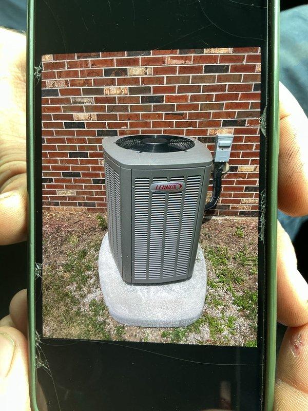 Responded to service call for 3-year-old Lennox A/C condenser unit with unstable platform mounting. Upon inspection, found outdoor condenser unit on concrete pad against exterior brick wall with significant leveling issues that compromised unit stability and posed risk of equipment falling. Used torpedo level to assess and verify pad alignment, then stabilized and secured condenser unit to platform, ensuring proper level positioning for safe operation and preventing potential damage to refrigerant lines and electrical connections. Unit now properly secured with both parts and labor under warranty coverage.