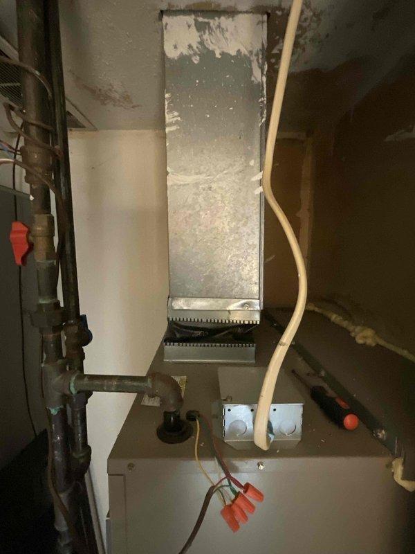 Provided estimate for replacement of 20+ year old natural gas furnace and air conditioning combo unit located in main floor closet. Current air conditioning system is non-operational while furnace remains functional. Assessed existing electrical panel, ductwork connections, and equipment placement to determine replacement specifications and installation requirements.