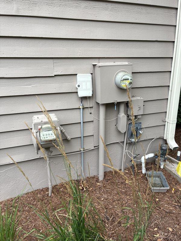 Completed electrical estimate for new whole home generator installation at residential property. Assessed existing electrical service panel, meter location, and utility connections on exterior wall to determine optimal placement and integration requirements for Kohler generator system. Evaluated proposed installation site adjacent to foundation with consideration for gas line routing, electrical connections, and clearance requirements per manufacturer specifications and local code compliance.