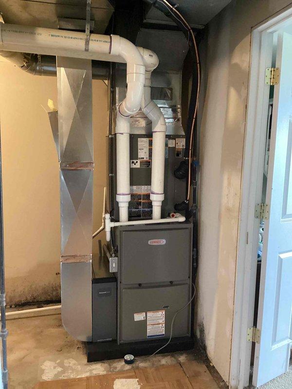 Completed full HVAC system installation including a 90,000 BTU Lennox furnace, 3-ton air conditioning unit with evaporator coil in rear discharge configuration. Installed complete PVC venting system for furnace exhaust and intake, routed copper refrigerant lines with proper support brackets, and connected metal supply ductwork. Performed all electrical connections, reconnected existing system components, and verified proper operation of heating and cooling functions.