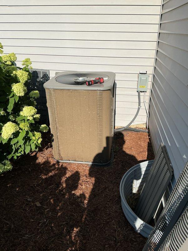 Completed annual preventative maintenance on residential air conditioning system. Inspected outdoor condenser unit, noting significant debris accumulation on intake filter screen which was cleaned to restore proper airflow. Verified operation of condenser fan assembly, checked refrigerant service valves, and confirmed electrical connections at disconnect box were secure.