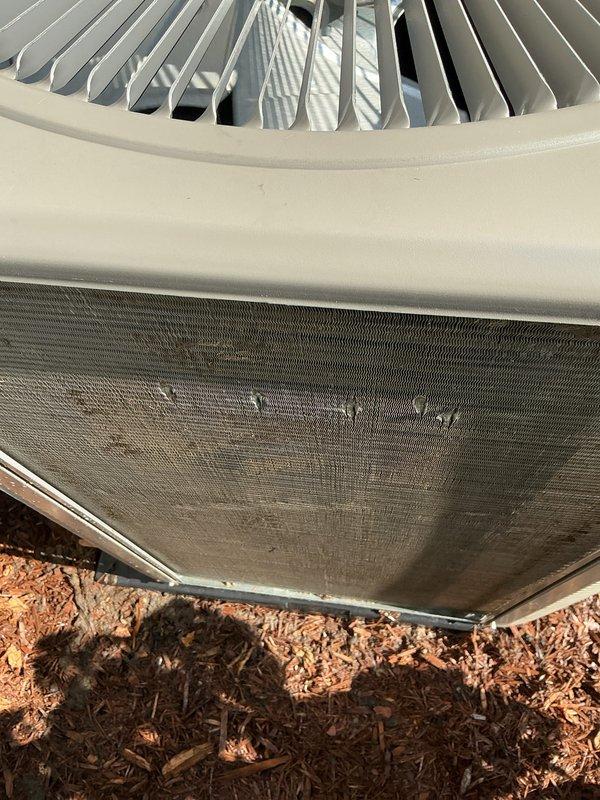 Completed annual preventative maintenance on residential air conditioning system. Inspected outdoor condenser unit, noting significant debris accumulation on intake filter screen which was cleaned to restore proper airflow. Verified operation of condenser fan assembly, checked refrigerant service valves, and confirmed electrical connections at disconnect box were secure.