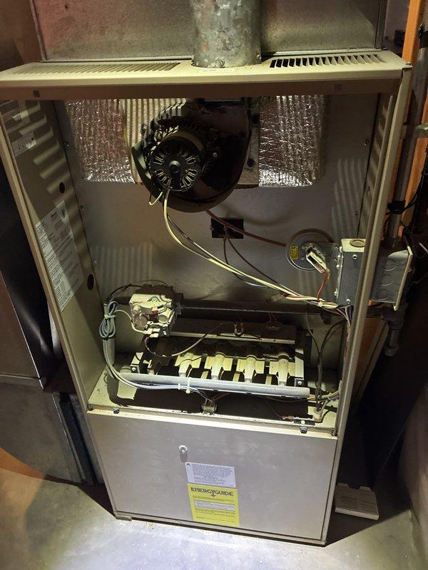 Conducted comprehensive evaluation of existing HVAC system including 33-year-old furnace located in basement and aging central air conditioning unit. Performed visual inspection of furnace cabinet, blower motor assembly, burner compartment, and ductwork to assess overall condition and remaining service life. Inspected electrical panel and circuit breaker configuration to verify compatibility with replacement equipment options. Documented current system specifications and photographed existing installation for replacement estimate preparation. Both systems remain operational but replacement recommended due to age and efficiency considerations for whole-home comfort solution.