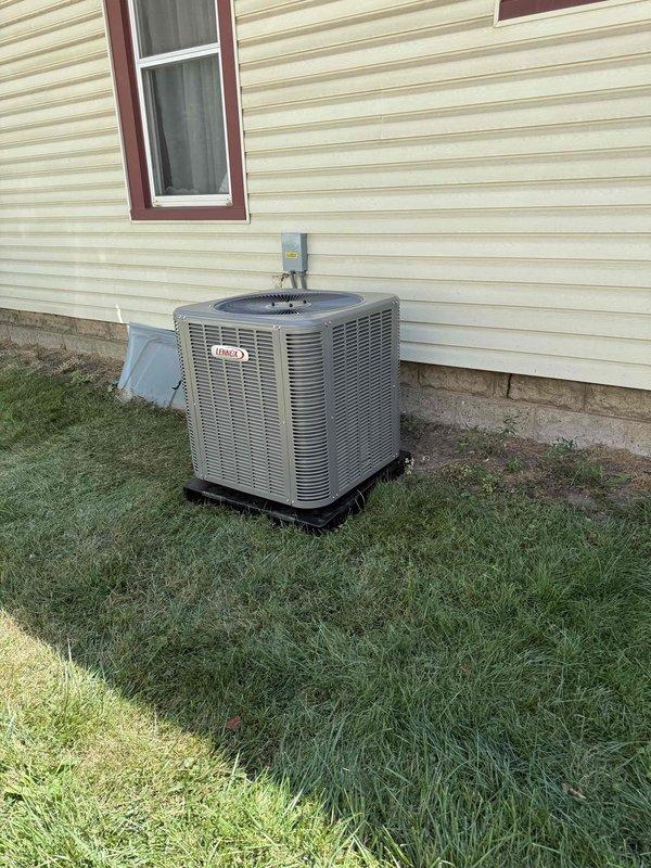 Completed full HVAC system installation including 70,000 BTU furnace with humidifier and 2.5-ton air conditioning unit. Installed Lennox outdoor condensing unit on rubber pad with proper refrigerant line routing and electrical disconnect. Indoor air handler positioned in basement with stainless steel venting, all ductwork connections completed. System installed per mechanical permit specifications with left-side configuration and existing electrical reconnection.