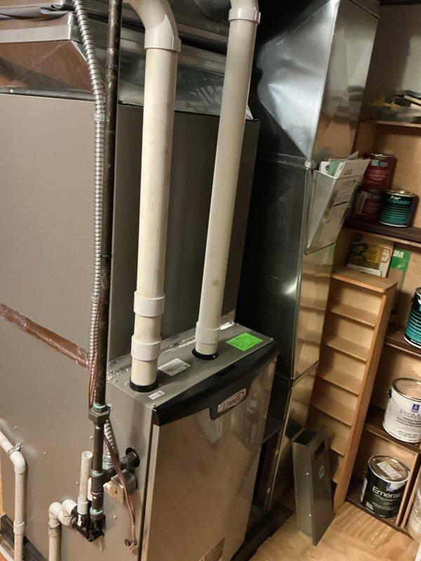 Completed annual maintenance on Lennox HVAC system. Inspected furnace/air handler unit in basement, verified thermostat operation and system controls, checked all mechanical components, ductwork connections, and PVC condensate drainage lines. System operating within normal parameters with fan running properly and temperature controls responding correctly.