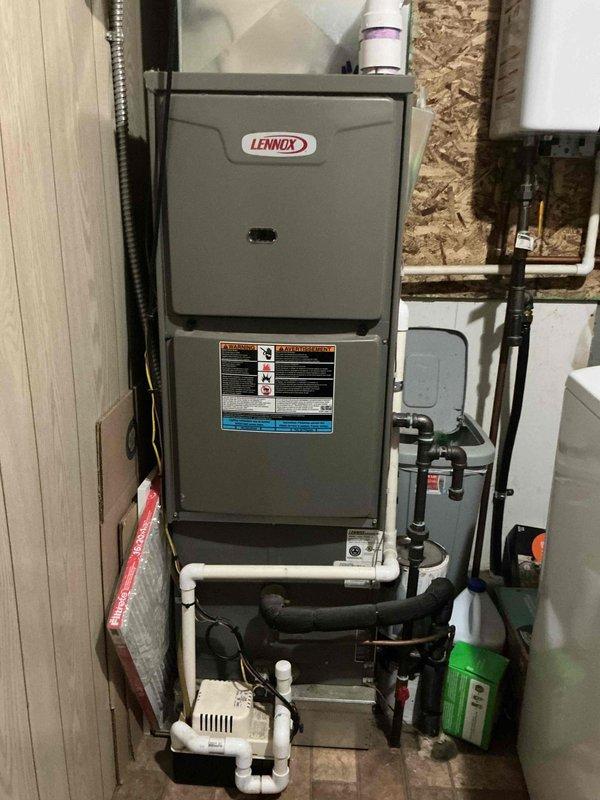 Responded to service call for 2023 Lennox HVAC system located in utility room reporting warm air discharge and abnormal noise. Upon arrival, performed comprehensive diagnostic evaluation of both indoor furnace unit and outdoor condenser. Inspected all electrical connections, refrigerant lines, and condensate drainage system. Verified proper operation of compressor, condenser fan motor, and blower assembly. System tested and returned to normal cooling operation with no further noise detected. Both parts and labor remain under manufacturer warranty coverage.