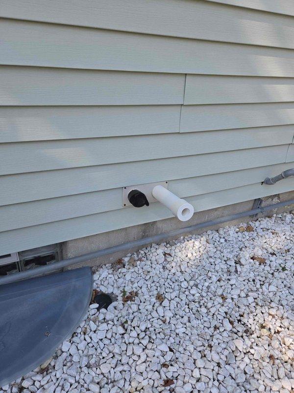 Completed full HVAC system installation including a 90,000 BTU furnace with humidifier and 3-ton air conditioning unit with rear discharge configuration. Installed new equipment in basement mechanical room on platform base with proper condensate drainage routed through exterior wall via PVC piping. All ductwork connections completed, electrical reconnected, and venting properly installed per manufacturer specifications.