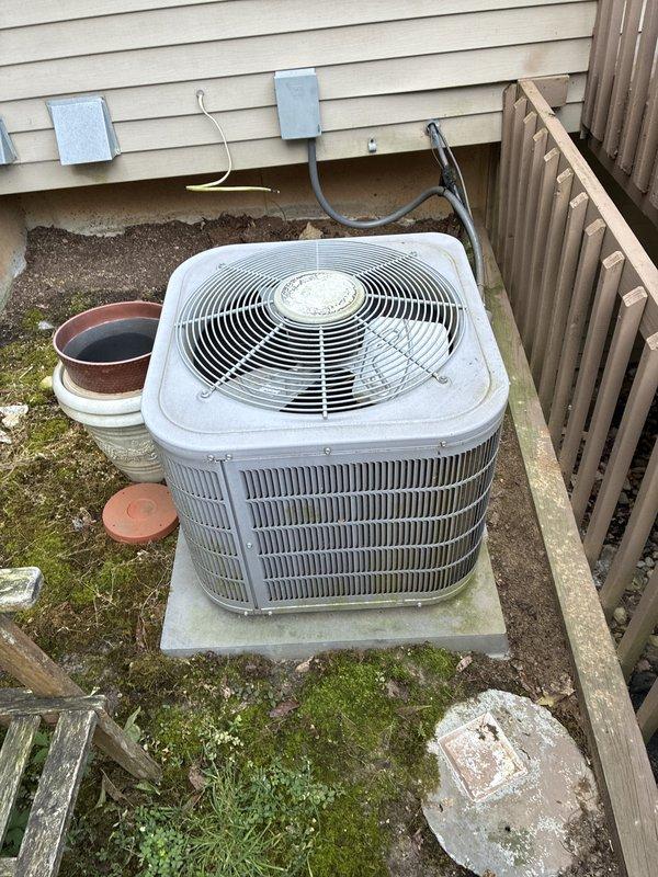 Conducted on-site evaluation of existing 8-year-old central air conditioning system for replacement estimate. Inspected outdoor condenser unit showing normal wear and age-related surface weathering, currently operational with no reported performance issues. Documented indoor air handler equipment and associated mechanical connections in preparation for system replacement scheduled within two-week timeframe.